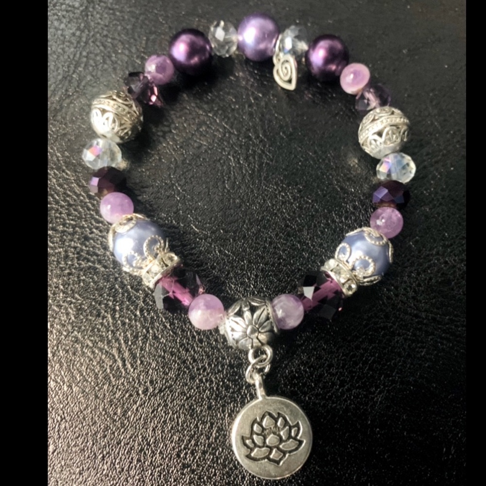 Beautiful mix of purple, crystal silver bead Lotus Flower Koru heart bracelet.
